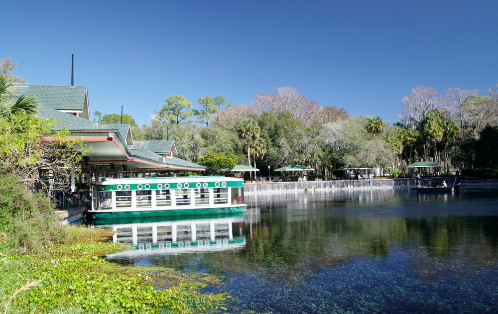 Silver Springs in Florida with a boat docked at a building.