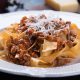 Photo of pasta with a Bolognese sauce.