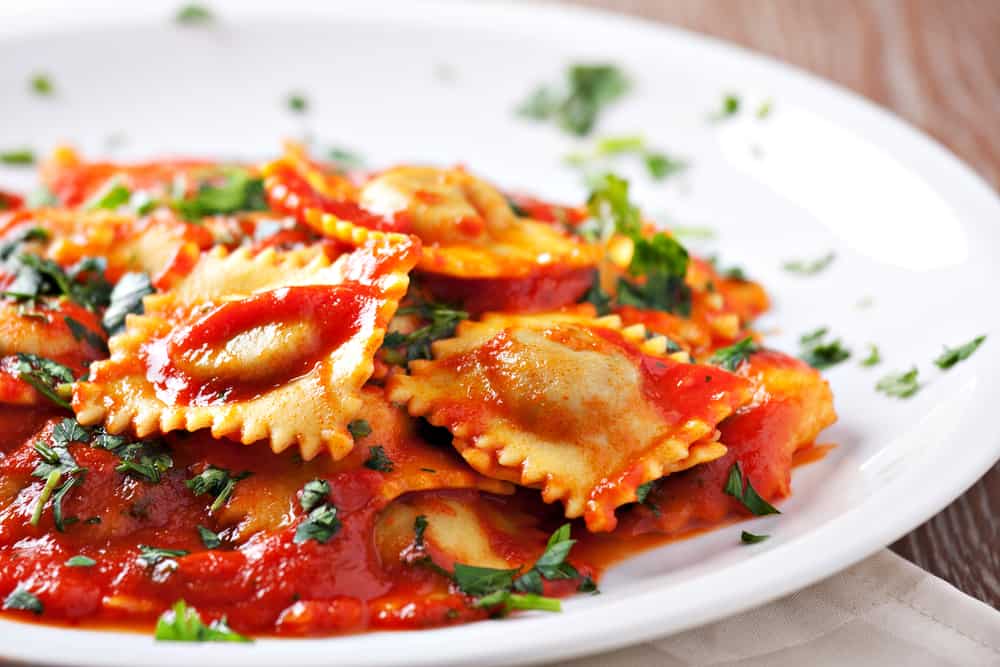 Homemade pasta at Trevi Pasta in orlando served is Ravioli with tomato basil sauce