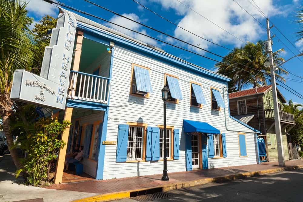 The blue, wooden exterior of Blue Heaven restaurant in Key West.