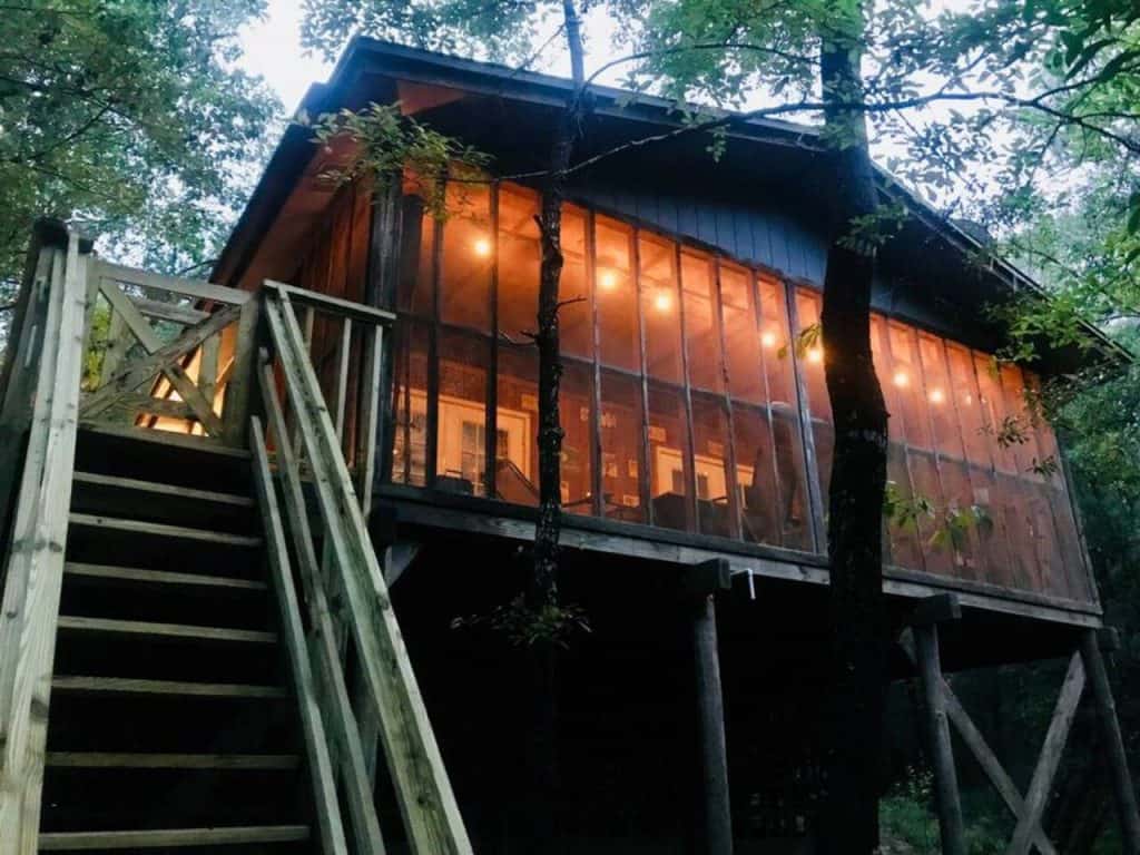 Photo of stairs leading up to this cozy river retreat, one of the best cabins in Florida.