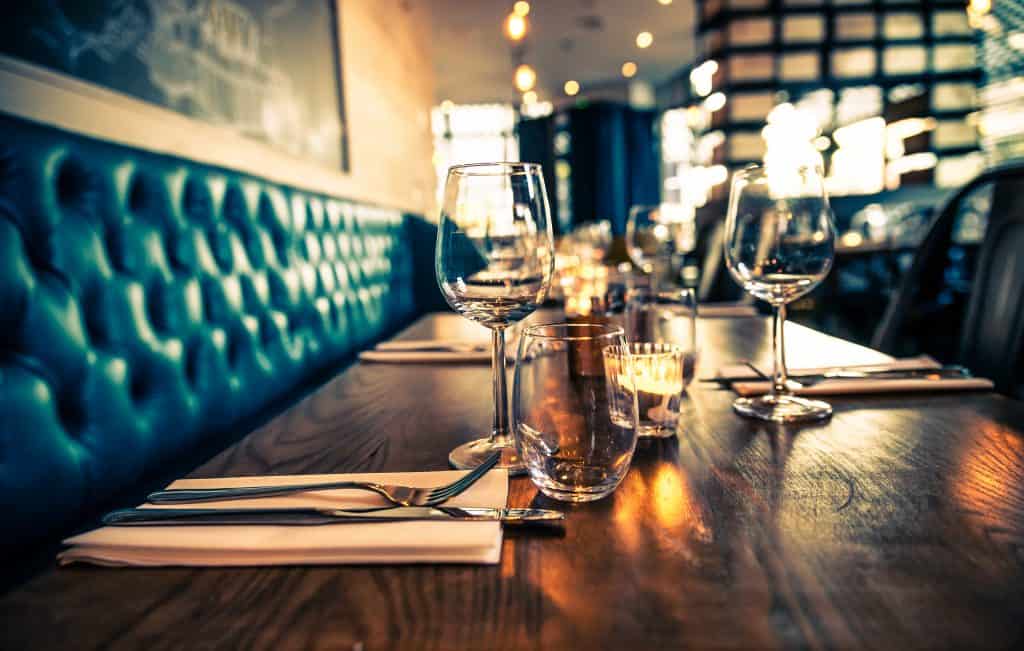 A table at a fine-dining restaurant is set and ready for diners.