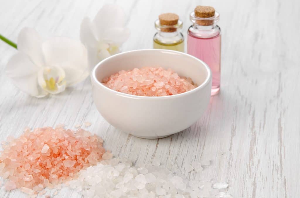 A pink Himalayan salt scrub treatment, ready to be applied at one of the best spas in Florida.