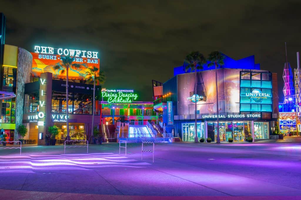 The shops and signage at CityWalk, lit up in the evening.