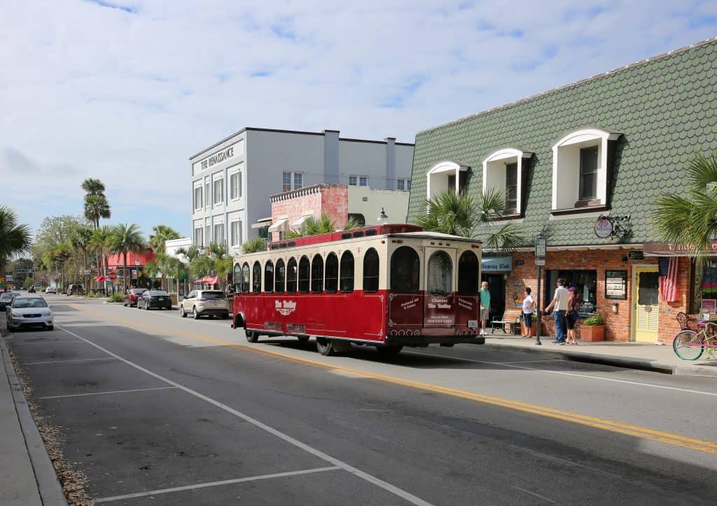 A streetcar cruises downtown in Mount Dora, one of the best places to have a date night in Orlando.