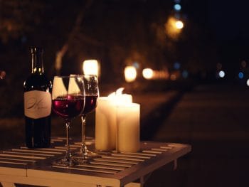 Romantic candles and wine lay the foundation for a perfect date night in Orlando.