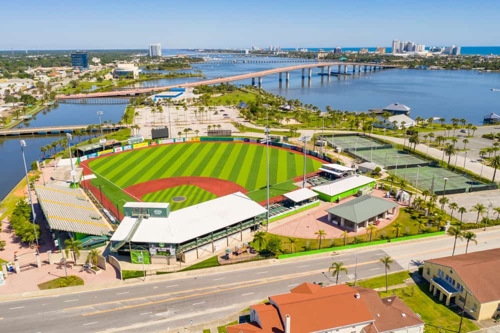 Aerial view of Jackie Robinson Ballpark with water on one side.