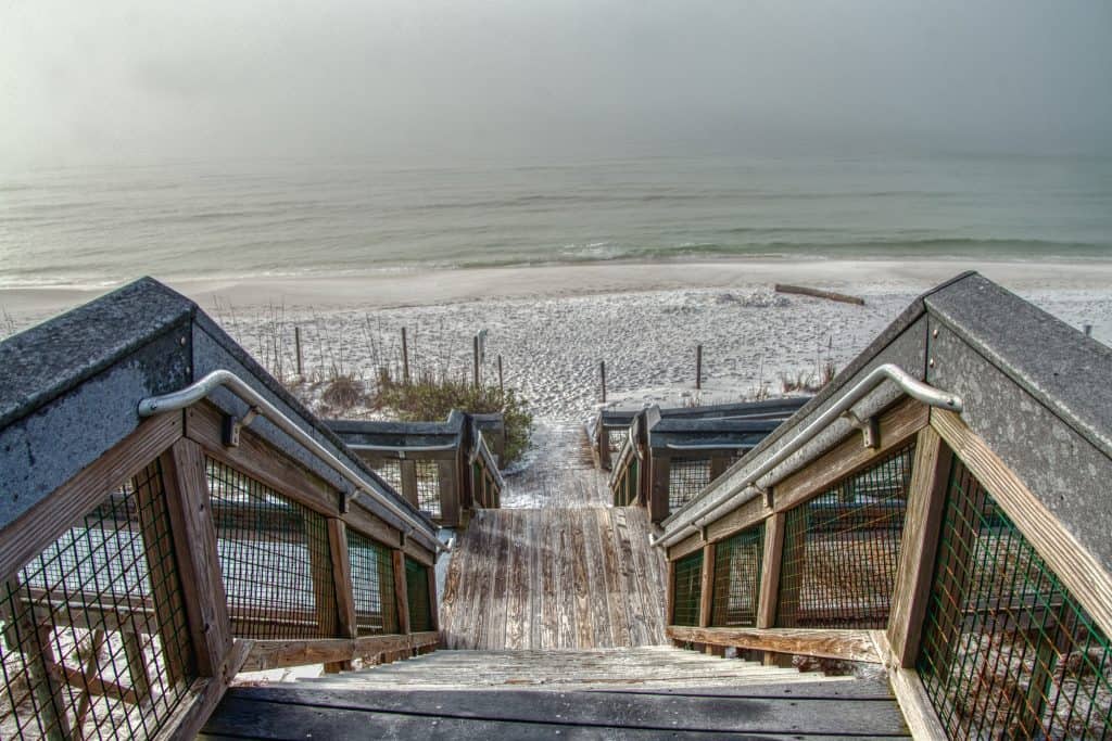 A dock leads guests down to the shores of Grayton Beach State Park.