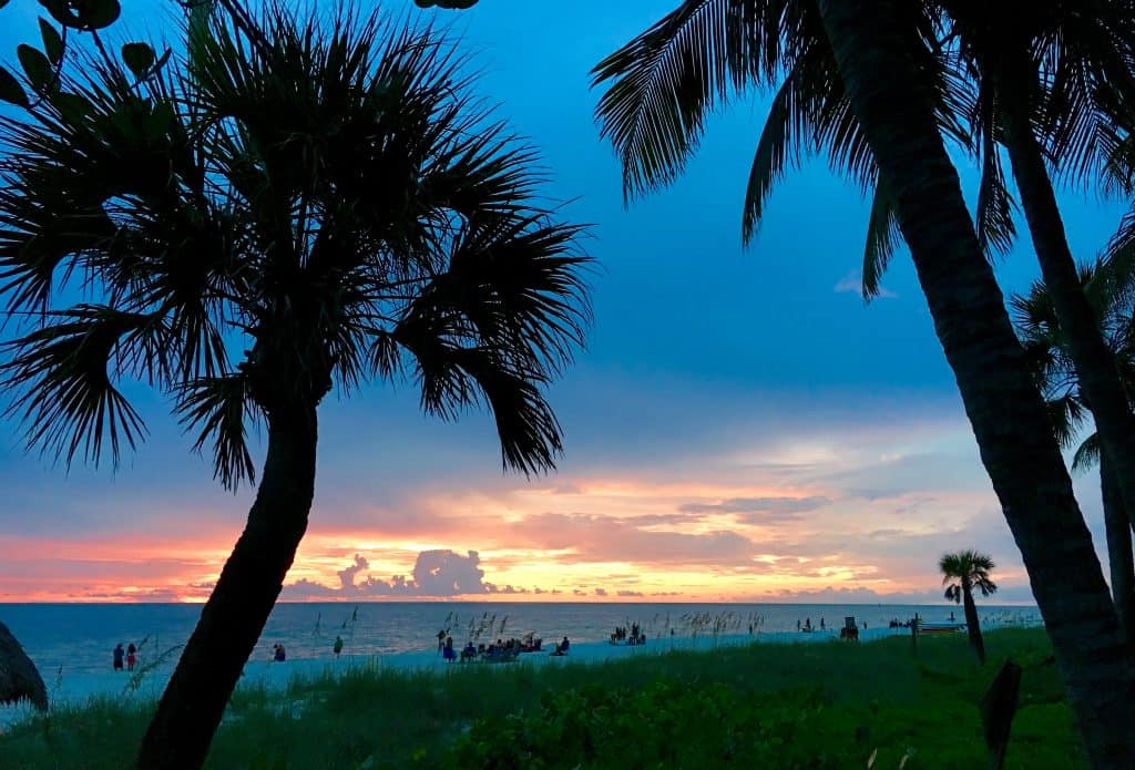 The view of the sunset on the beach from the lawn of Lowdermilk Beach Park.