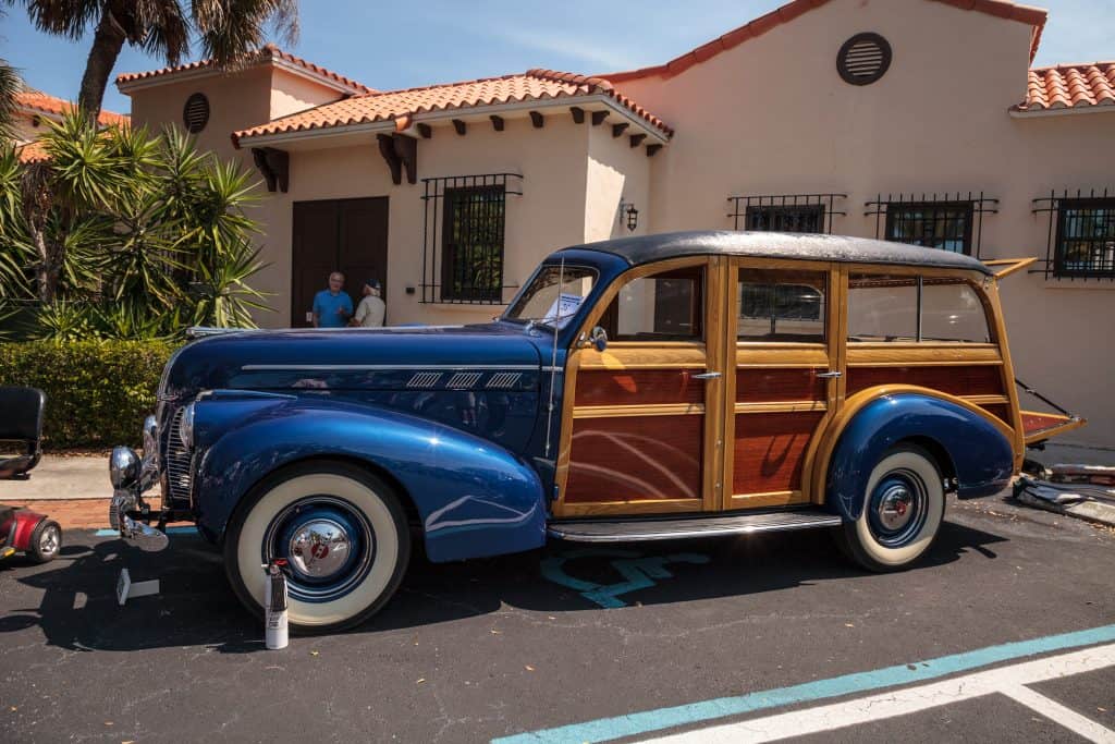 A vintage car sits outside of the Naples Depot Museum, one of the best things to do in Naples, Florida.