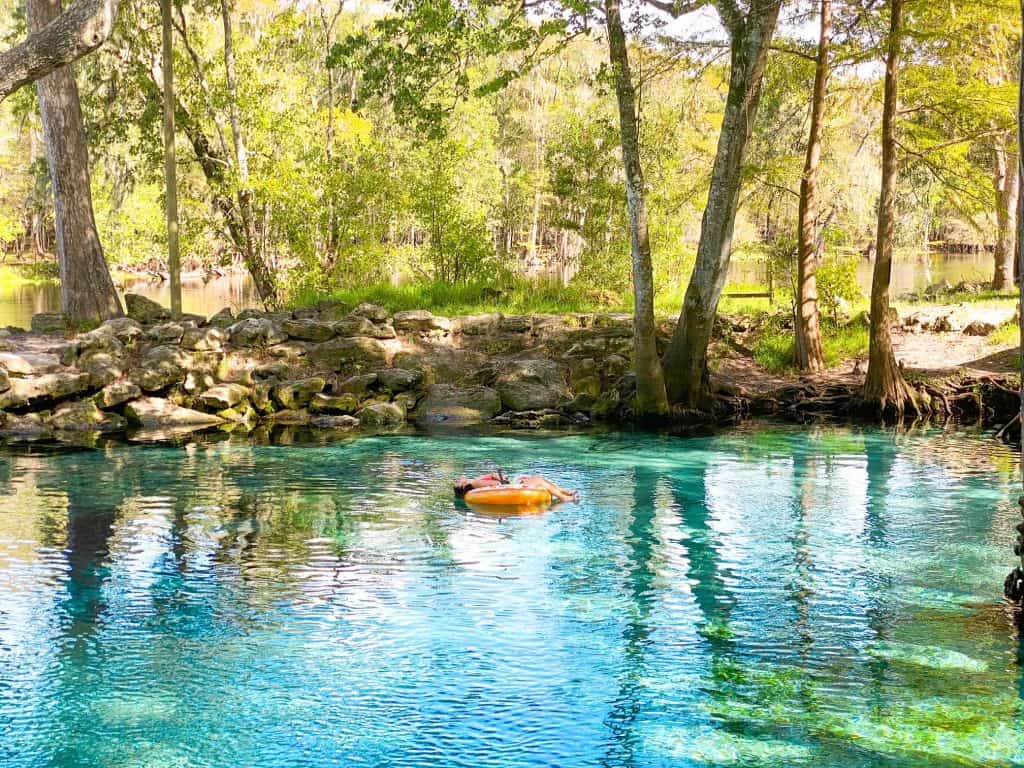 Woman laying in a tube at Ginnie Springs, Florida.