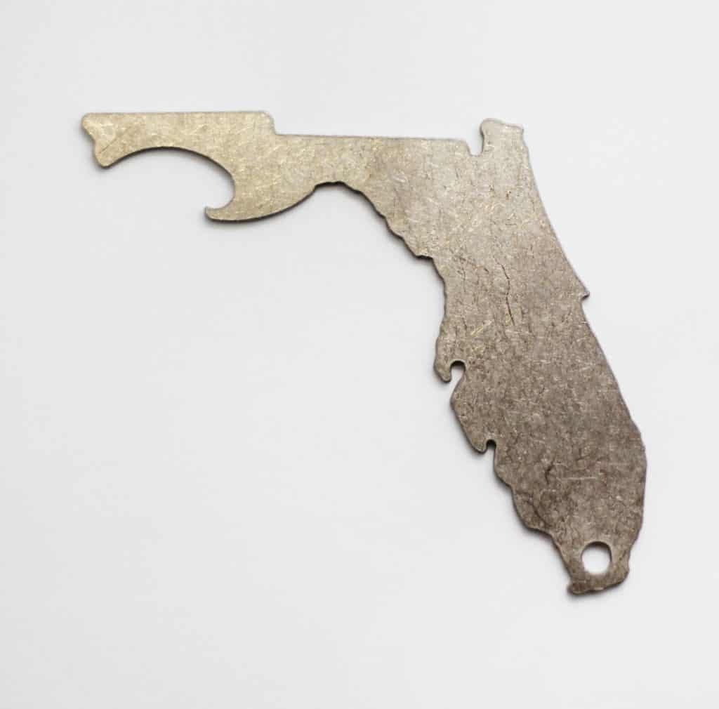 Photo of a stainless steel Florida shaped bottle opener, one of the best Florida gifts and souvenirs. 