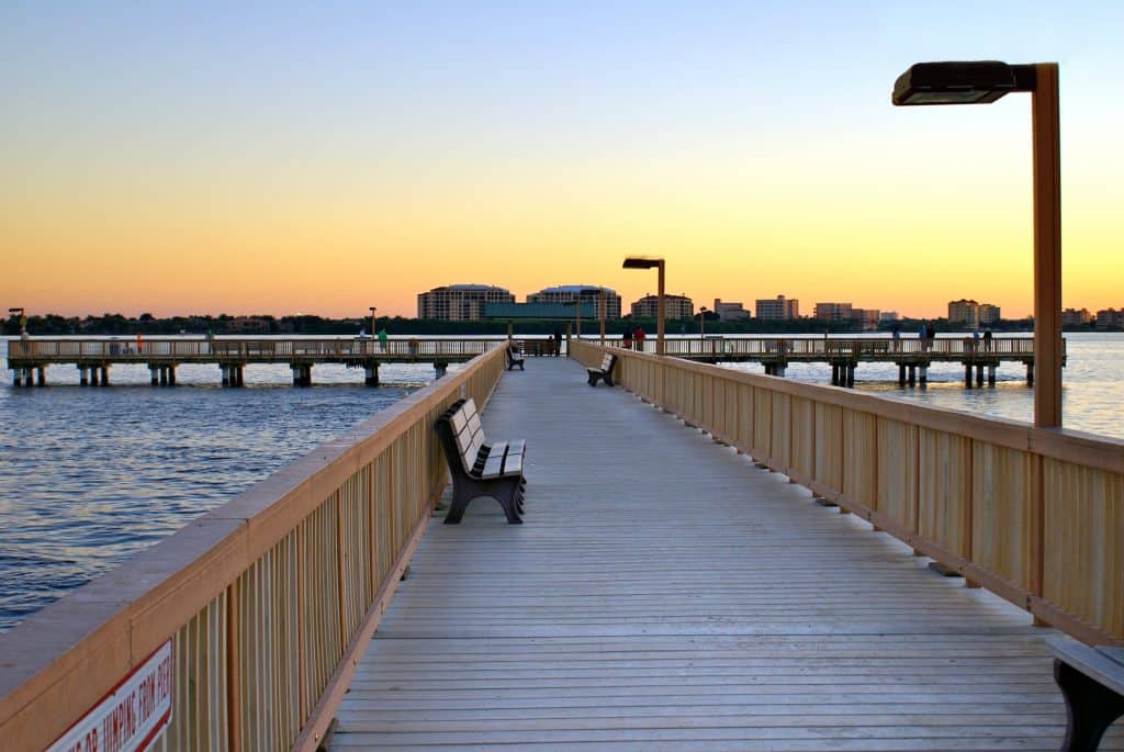 The fishing pier at the Yacht Club Community Park at sunset, one of the best things to do in Cape Coral. 