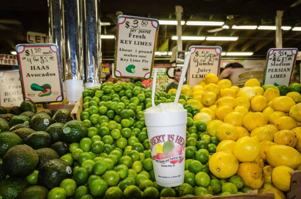 Avocados, limes, and lemons sit with a key lime milkshake at Robert Is Here, one of the best things to do in Miami.