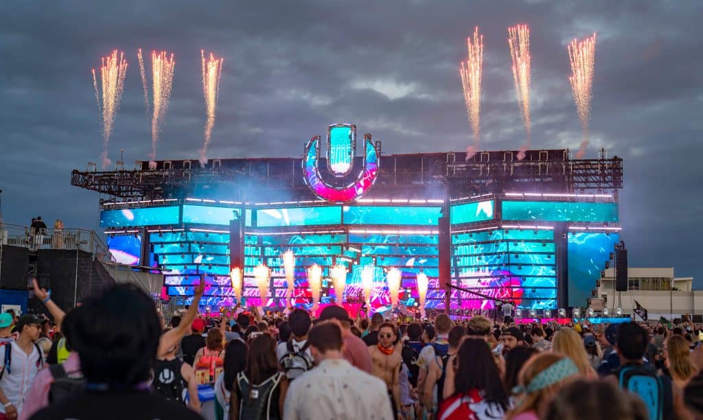 A crowd enjoys the pyrotechnics onstage at Ultra Music Festival, one of the best things to do in Miami.