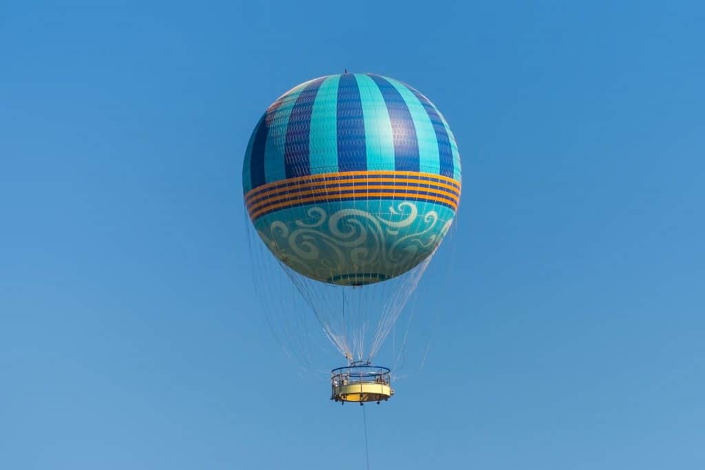 A hot air balloon soars over the Florida landscape, one of the best things to do in Orlando.