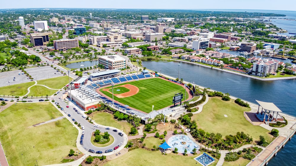 Aerial view of the Blue Wahoos Ballpark next to the water.