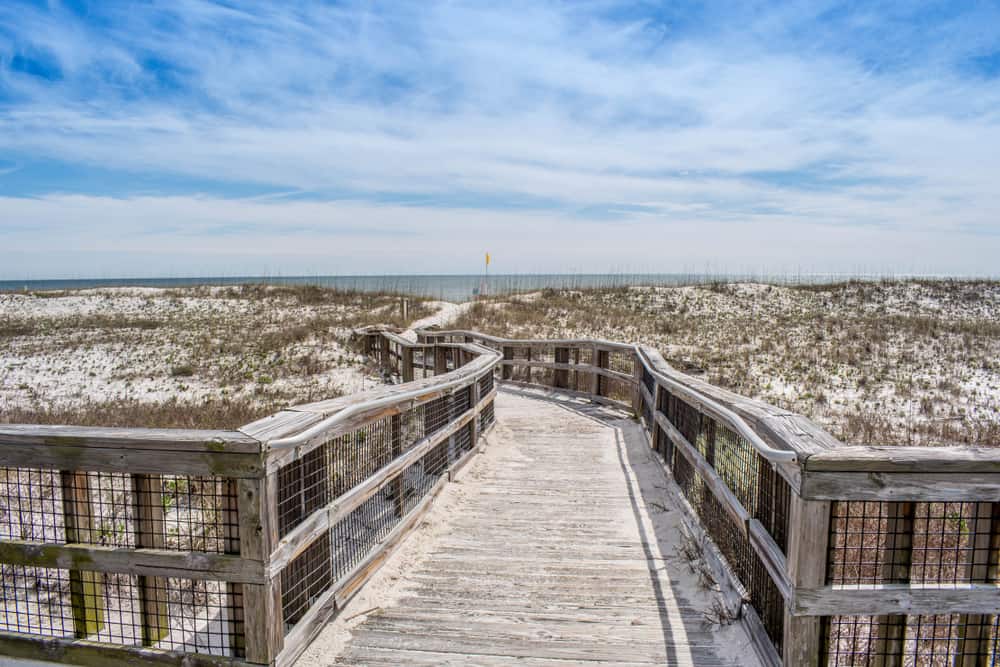 The wooden boardwalk leads to the ocean at Peridido Key State Park.