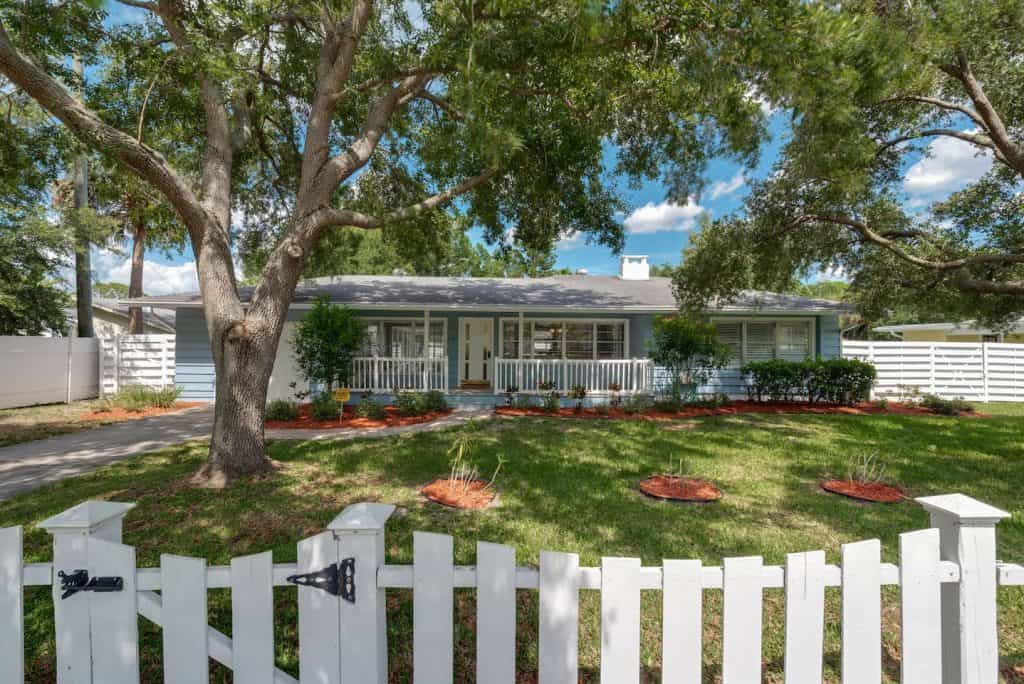 Photo of the exterior of a cottage-style home Airbnb in Sarasota.
