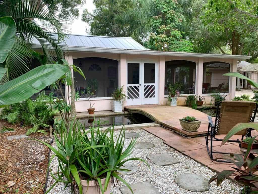 Photo of a lush and tropical backyard of an Airbnb in Sarasota. 