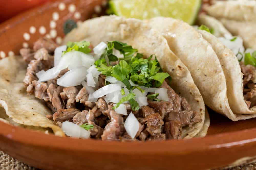 A plate of tacos with carnitas at Casa Maya a downtown Saint Augustine restaurant.