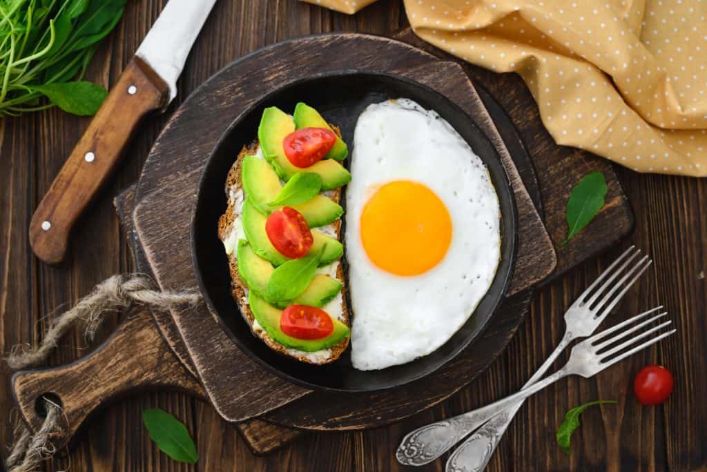 Avocados and an egg sit in a skillet, perfect for breakfast in Key West.