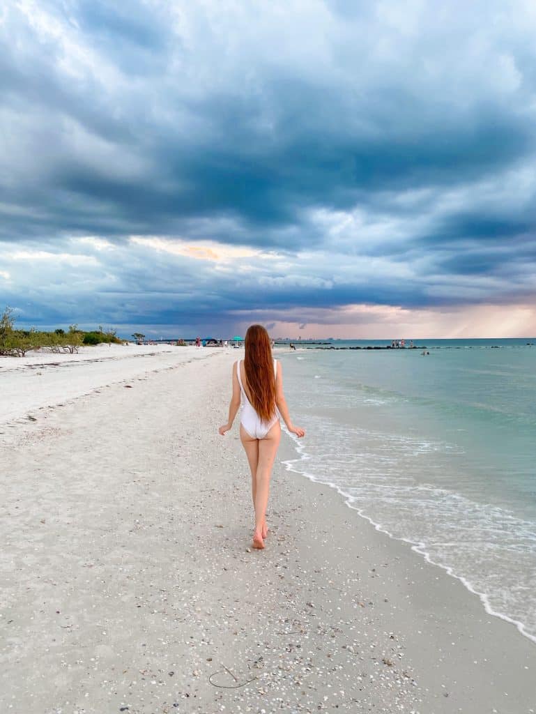 walking away into a storm at honeymoon Island