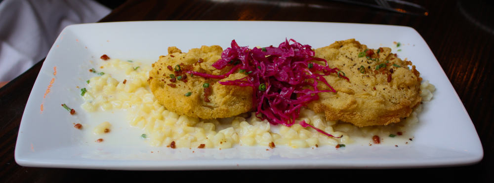 Try the southerfood at the Ravenous Pig like the fried green tomatoes