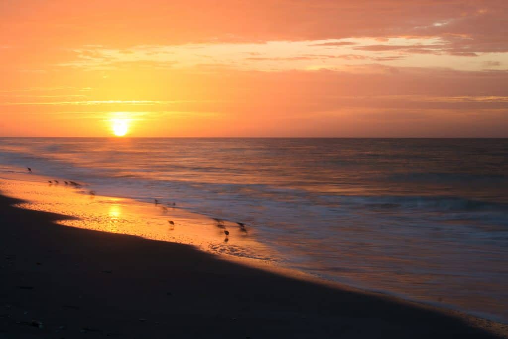 The sun sets on Tarpon Bay Beach on Sanibel Island.