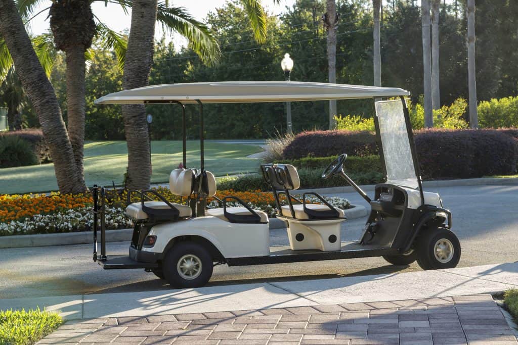 A golf cart sits waiting to take guests to the courses at Oaks National Golf Club.