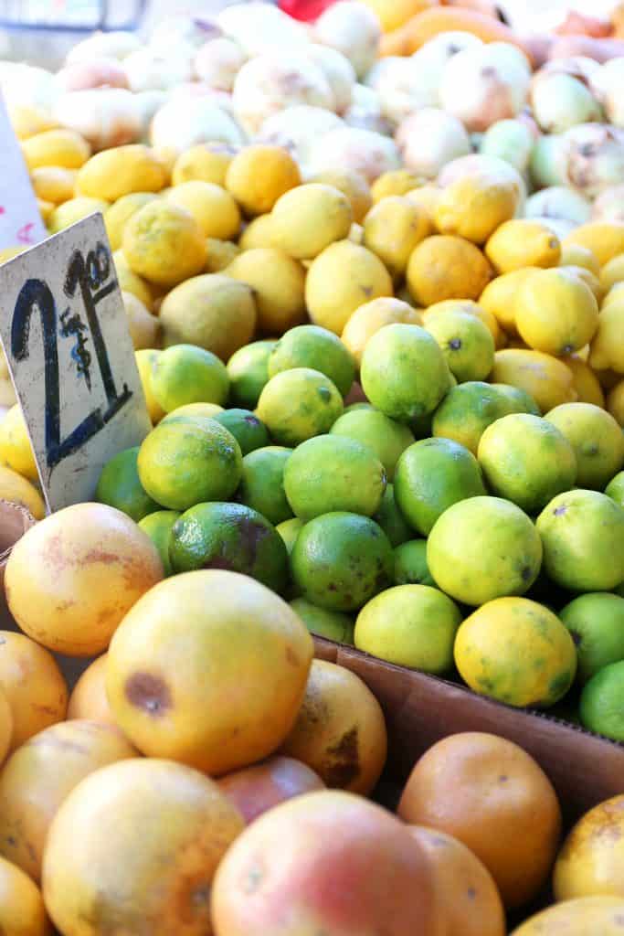 Fresh lemons, limes, and other fruits are stacked neatly at the Marco Island Farmers Market, one of the best things to do in Marco Island.