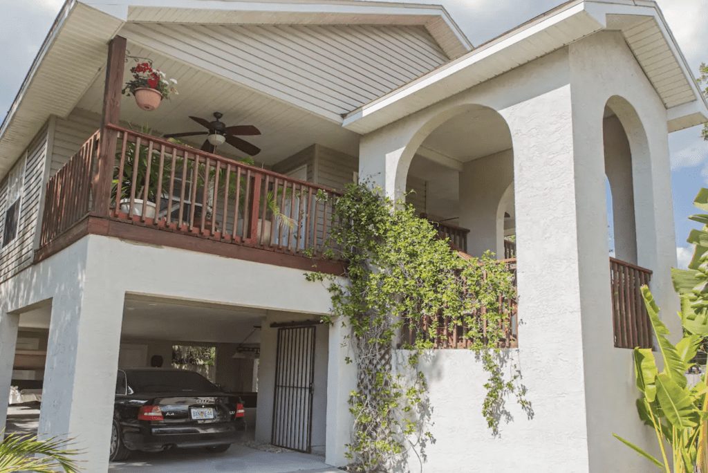 Vines hang from the balcony of the Tampa Treehouse, one of the best treehouses in Tampa.