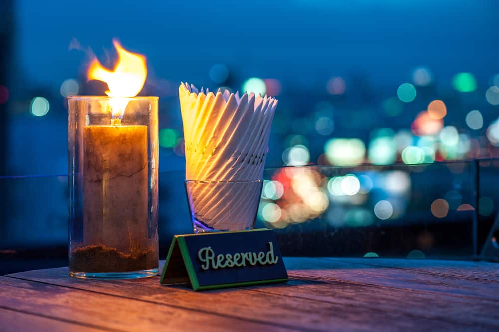 A reserved table against the night sky