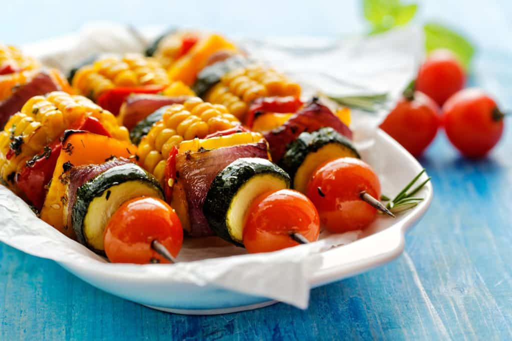 A set of kebabs filled with vegetables, grilled to perfection.