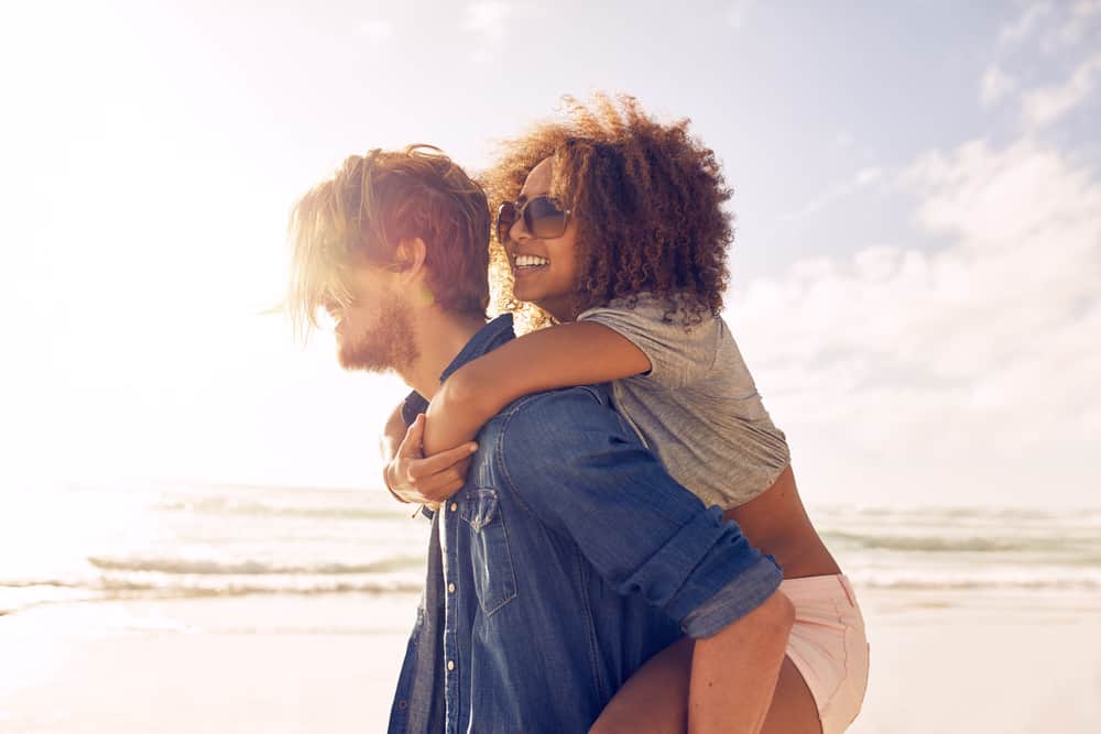 A couple on the beach in an article about the best Florida beaches for couples