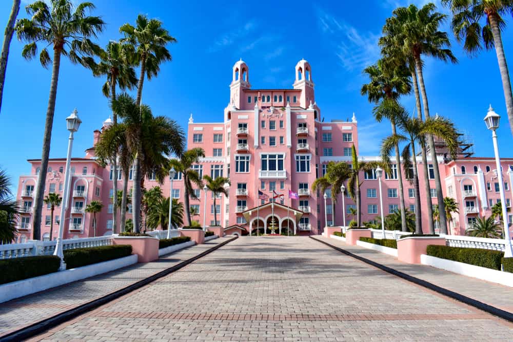 The palm-lined entrance to the big, coral pink palace exterior of the Don Cesar Hotel, one of the best things to see in Central Florida.