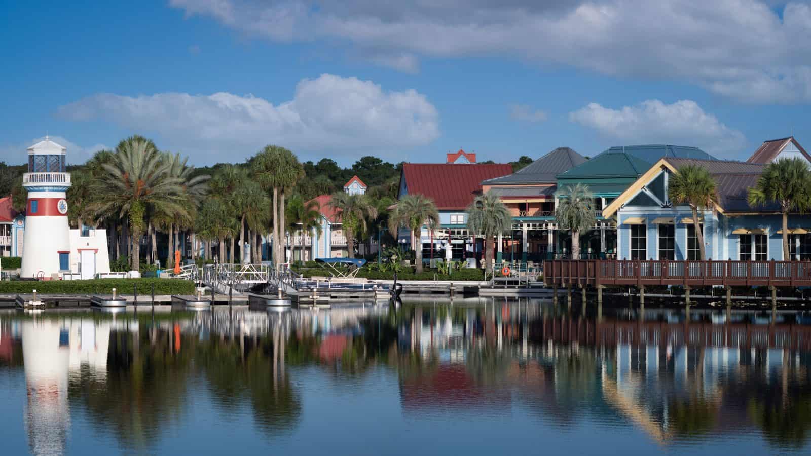 The quaint skyline of a small town in Florida is reflected in the water.