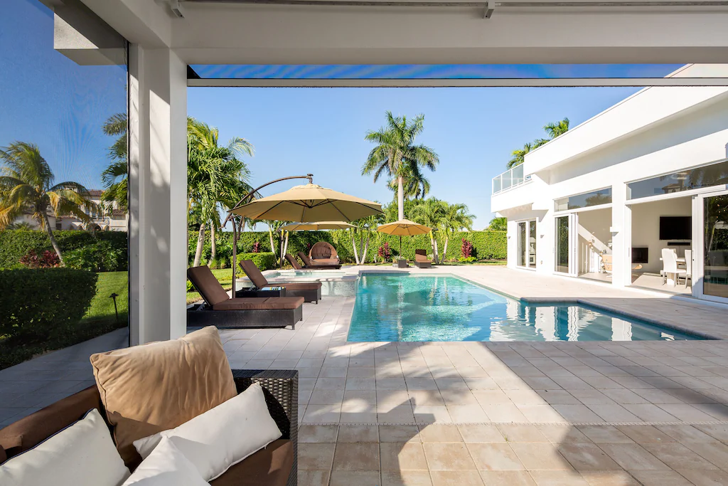 Photo of the lanai and pool at a Naples Bay designer home. 
