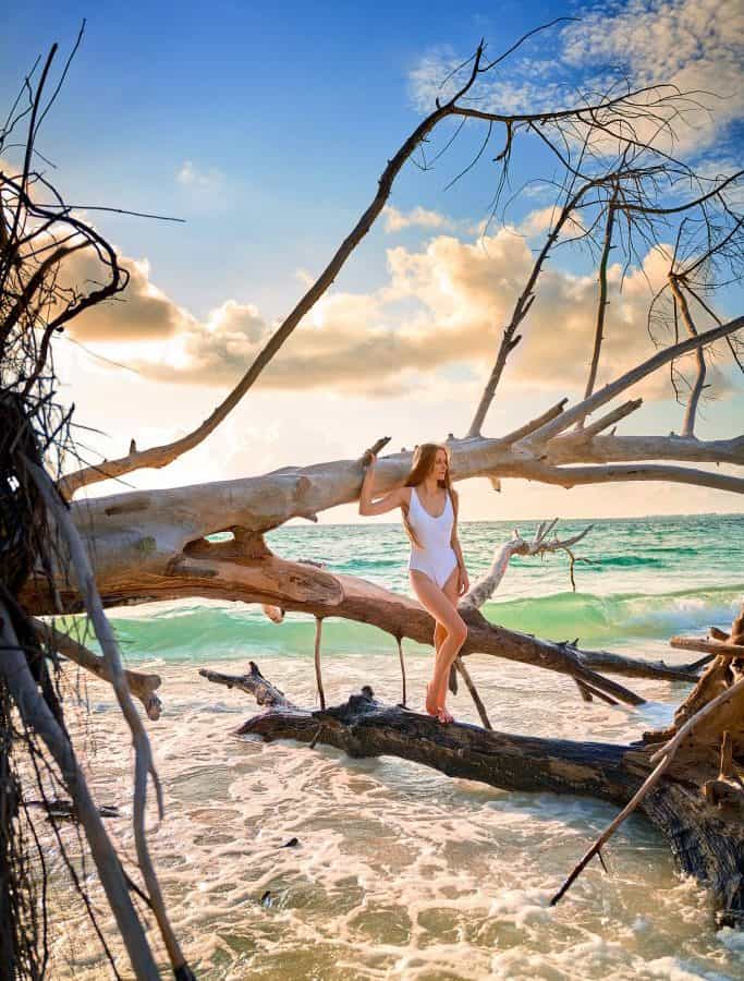 girl standing at beer can island, one of the best day trips from naples