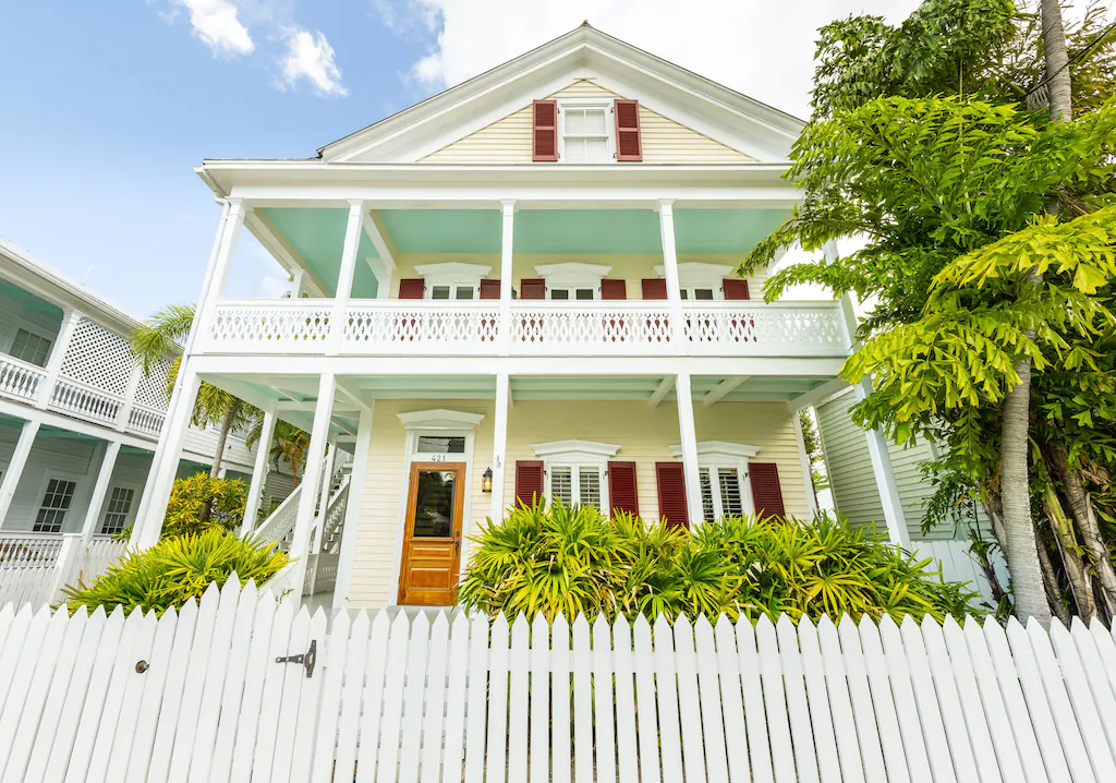 Photo of the front exterior of a beautiful 2-story VRBO in Key West.