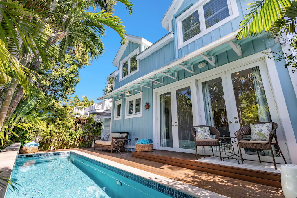Photo of the exterior of a cottage-style home with pool that is a VRBO in Key West.