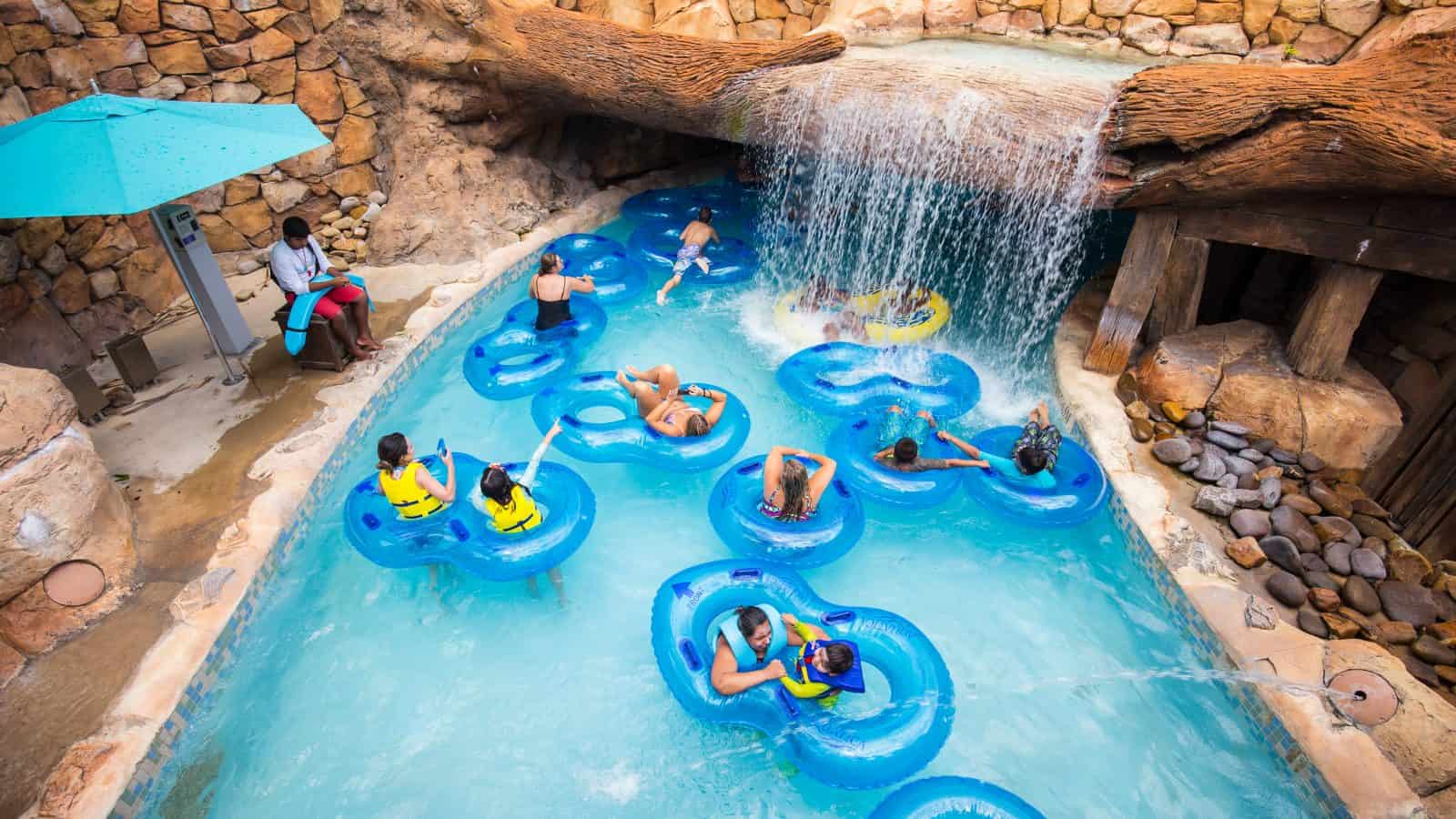 inner tubes in a water park in florida with a waterfall