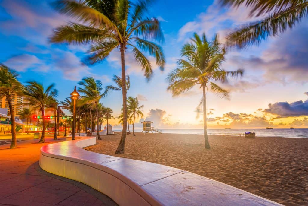 The sun sets on the beach of Fort Lauderdale, one of the best day trips from Miami.