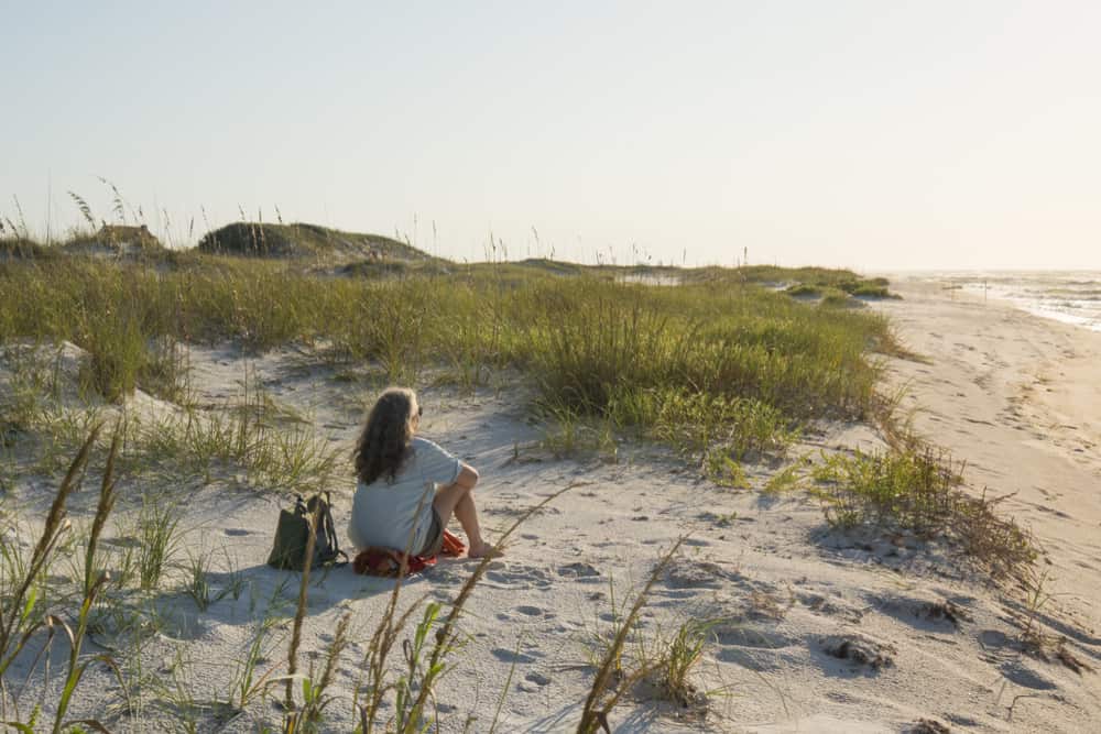 PHOTO OF PERSON ON PARK WEST BEACH ONE OF THE BEST BEACHES IN PENSACOLA