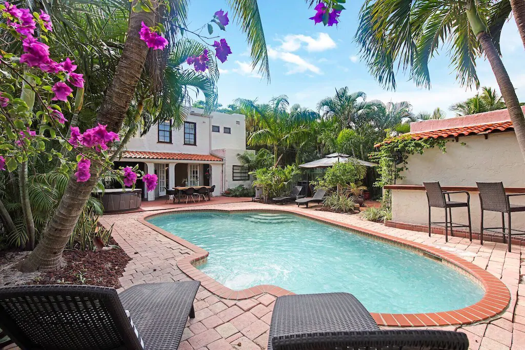 The pool and the flowers make the Spanish villa the prettiest airbnb in Florida