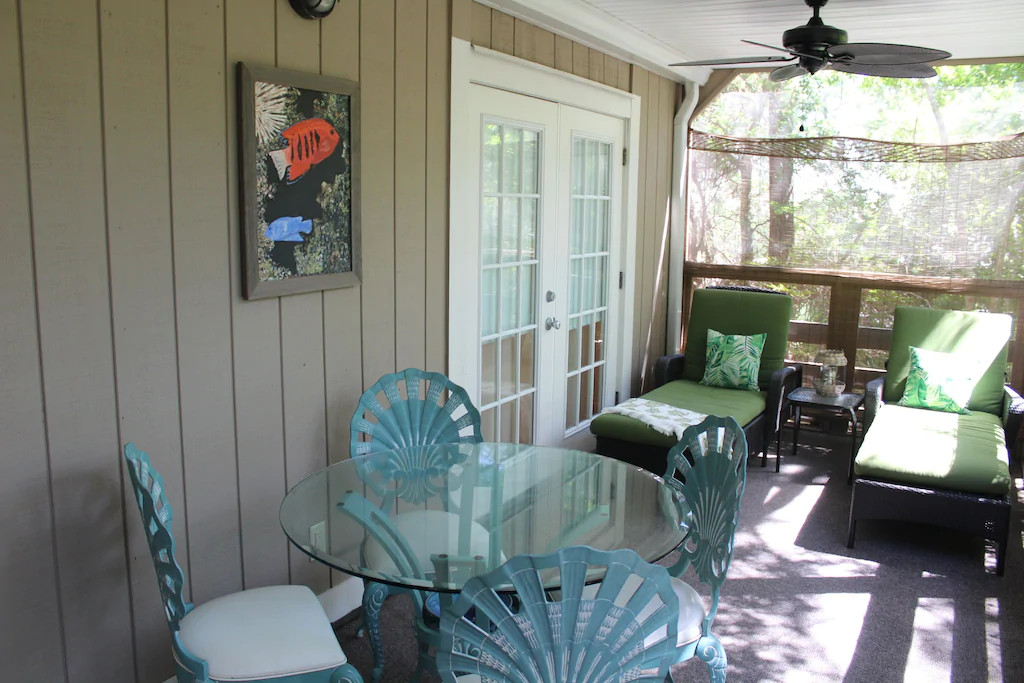 A beautiful screened in porch makes this listing feel like a Florida paradise