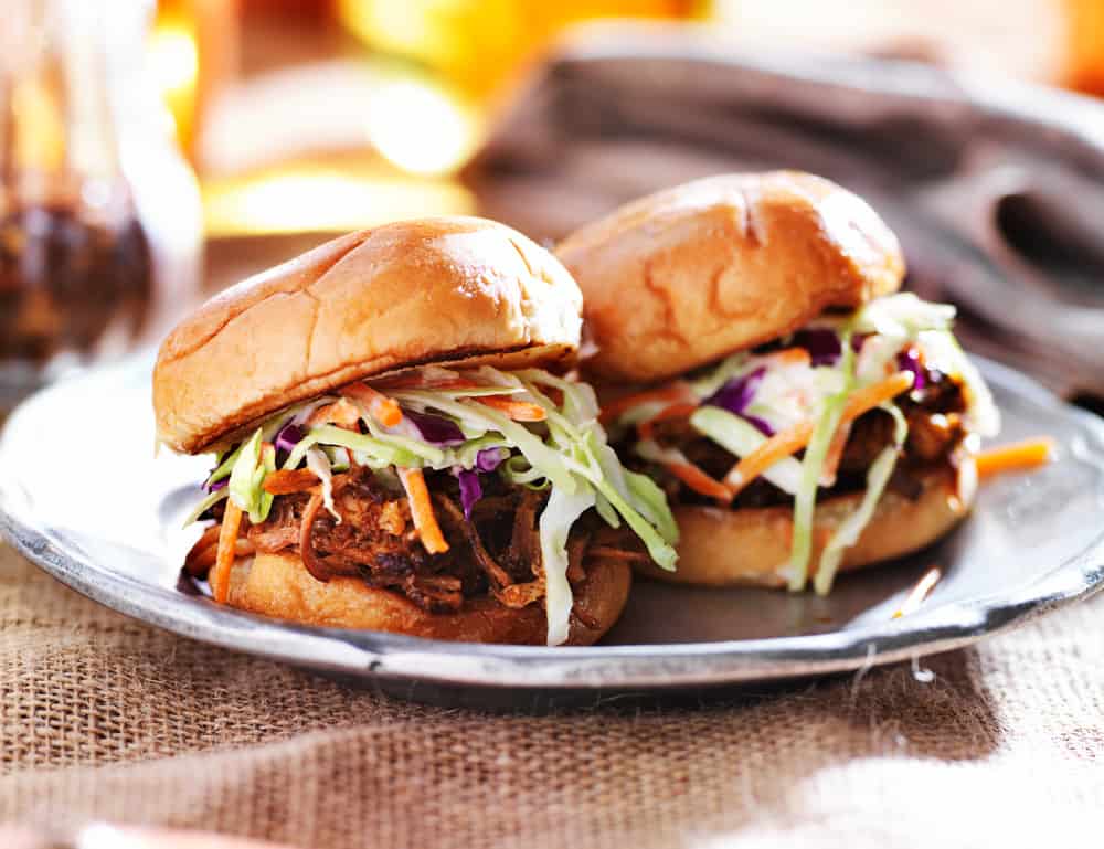 two bbq pork sandwiches with slaw 