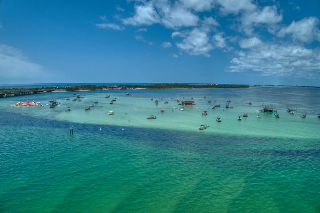 The clear blue-green waters of Crab Island, Florida glitter in the sunlight.