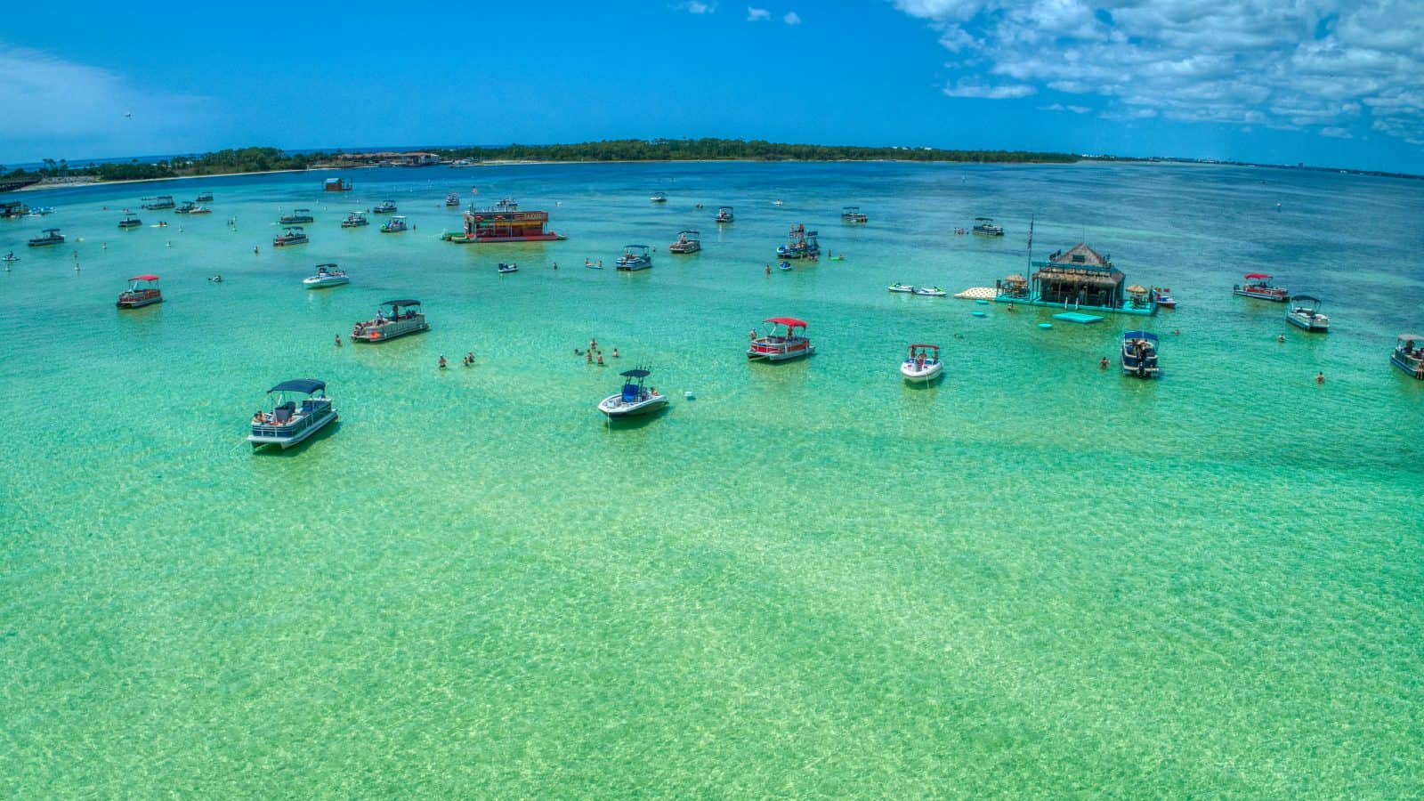 The clear blue-green waters of Crab Island, Florida glitter in the sunlight.