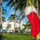 A Christmas stocking hanging ona aplan tree in an article about Christmas in Miami